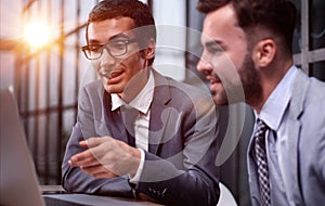 Business Having Meeting Around Table In Modern Office