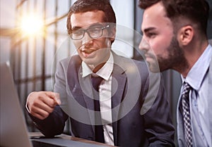 Business Having Meeting Around Table In Modern Office