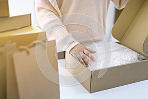 Business From Home woman preparing package delivery box Shipping for shopping online. young start up small business owner at home
