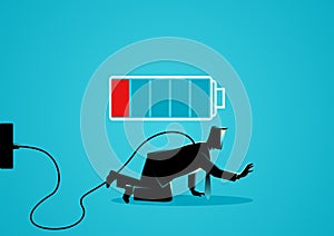 Businessman crawling on the floor with low battery indicator