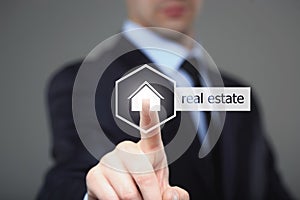 Business, internet and networking concept - businessman pressing real estate button on virtual screens
