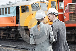business investor engineer team working survey at site outdoor old locomotive depot diesel train yard plan for renovate