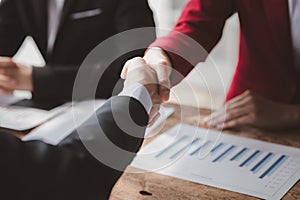 Business investor group handshake, Two businessmen are agreeing on business together and shaking hands after a successful