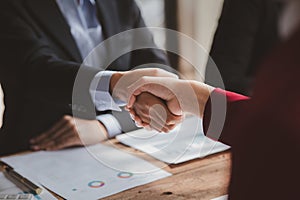 Business investor group handshake, Two businessmen are agreeing on business together and shaking hands after a successful