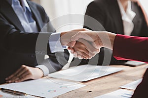 Business investor group handshake, Two businessmen are agreeing on business together and shaking hands after a successful