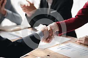 Business investor group handshake, Two businessmen are agreeing on business together and shaking hands after a successful