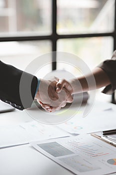 Business investor group handshake, Two businessmen are agreeing on business together and shaking hands after a successful