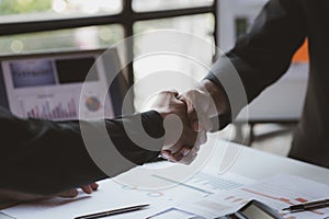 Business investor group holding hands, Two businessmen are agreeing on business together and shaking hands after a successful