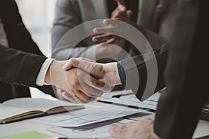 Business investor group holding hands, Two businessmen are agreeing on business together and shaking hands after a successful