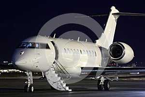 Business jet airplane at night.