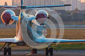 Business jet on the apron of aircraft. Dawn at