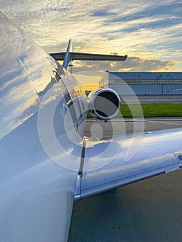 Business jet overwing view during sunset