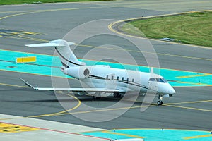 Business jet taxiing at airport photo