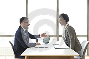 Business, job interview, career or negotiations concept, two employees on the meeting