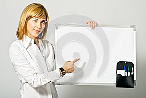 Business Lady pointing to Whiteboard