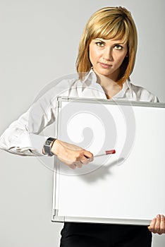 Business Lady pointing to Whiteboard