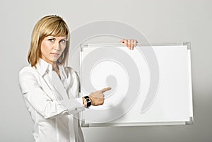 Business Lady pointing to Whiteboard