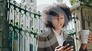 Business lady talking phone with coffee cup outdoors close up. Confident woman