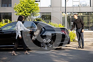 Business lady using luxury taxi service during a business trip