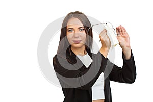 A business lady is wiping her glasses. Isolated on white background