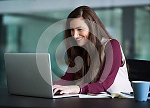 Business, laptop and happy or work woman, responding to email or browsing online with social media. Connection, internet