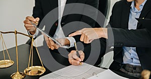 Business and lawyers discussing contract papers with brass scale on desk in office. Law, legal services, advice, justice and law