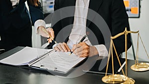 Business and lawyers discussing contract papers with brass scale on desk in office. Law, legal services, advice, justice and law