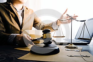 Business and lawyers discussing contract papers with brass scale on desk in office. Law, legal services, advice, justice and law