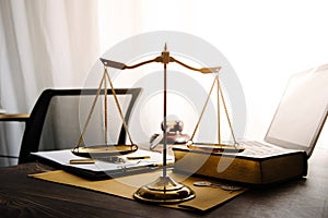 Business and lawyers discussing contract papers with brass scale on desk in office. Law, legal services, advice, justice and law