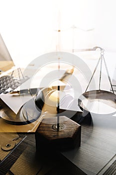 Business and lawyers discussing contract papers with brass scale on desk in office. Law, legal services, advice, justice and law