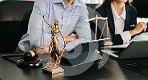 Business and lawyers discussing contract papers with brass scale on desk in office. Law, legal services, advice, justice and law