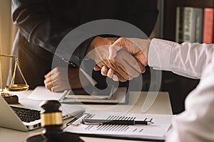 Business and lawyers discussing contract papers photo