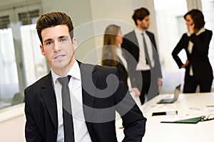 Business leader looking at camera in working environment