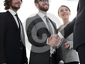 Business leader shaking hands with the investor