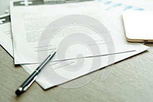 Business Legal Contract signing Concept. Close-up of pen on contract business document with lighting on desk.nobody