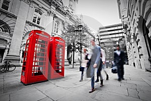 Business life concept in London, the UK. Red phone booth