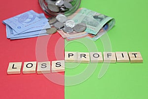 Business loss profit conceptual with coins banknotes