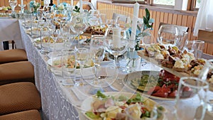 Business lunch. A beautiful festive table covered with a variety of food. Food and drinks on the festive table in the