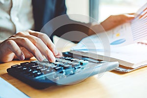 Business man Accounting Calculating Cost Economic Financial data photo