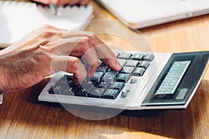 Business man accounting using calculating and work with laptop computer