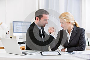 Business man arm wrestling at the office