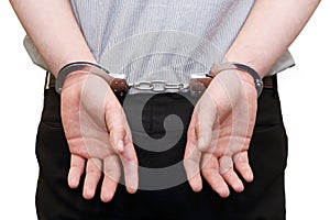 Business man arrested with handcuffs on his back