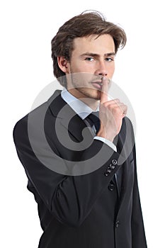 Business man asking for silence shh photo