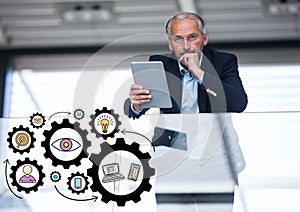 Business man on balcony with black gear graphics