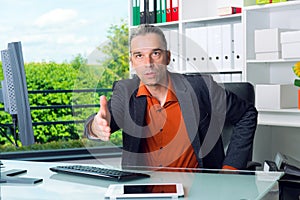 Business man behind his desk greeted a client