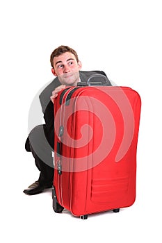 Business man behind luggage