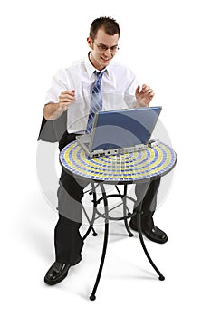 Business Man At Bistro Table With Working On Laptop photo