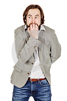 business man biting his nails fingers freaking out. human emotion expression and lifestyle concept. image on a white studio