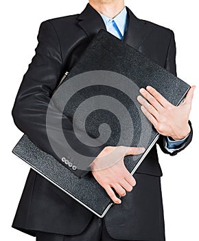 Business man in black suit hand holding briefcase