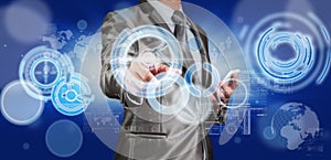 Business man in blue grey suit using digital pen working with di